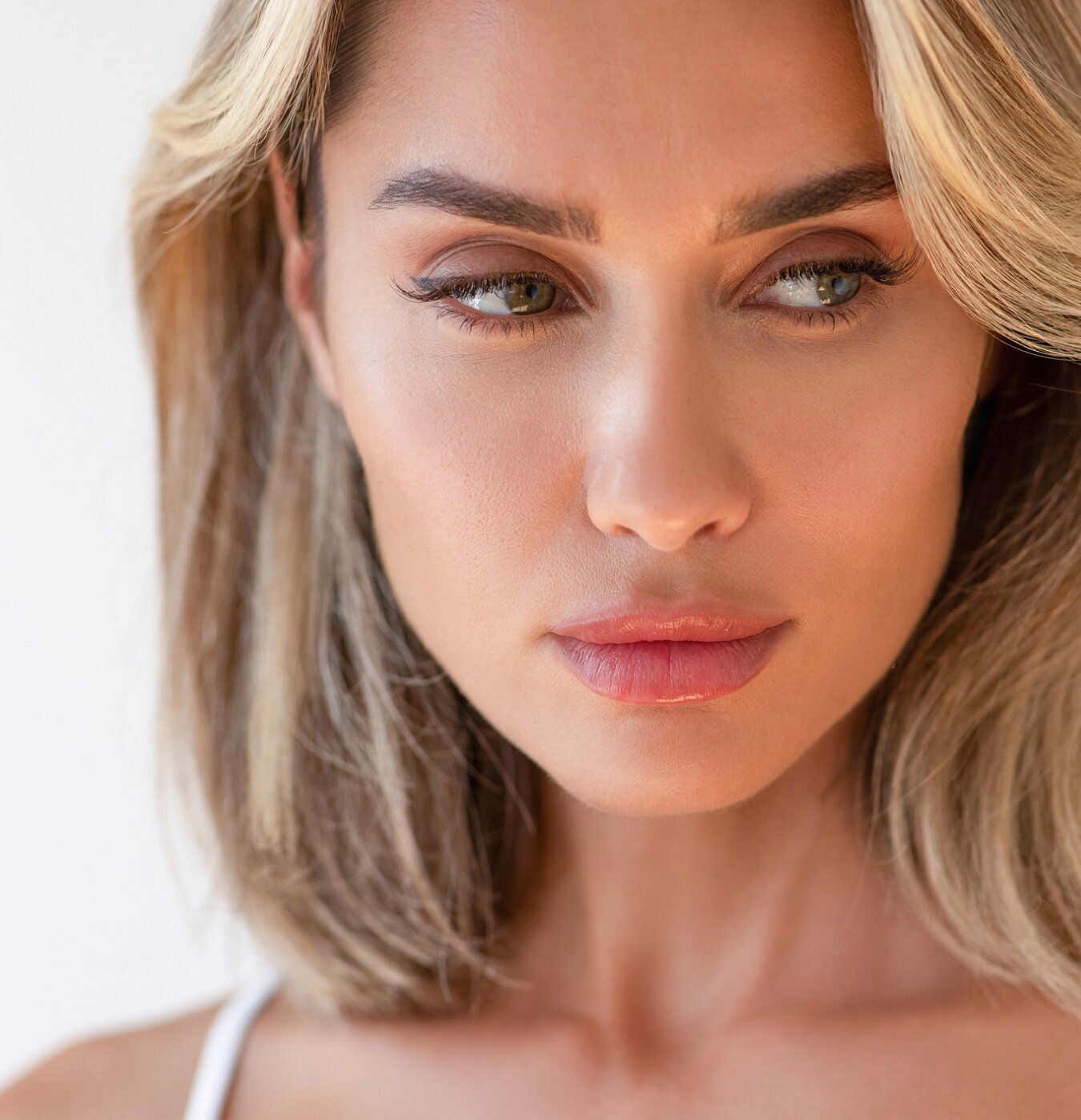 Close-up of a woman's thoughtful expression.